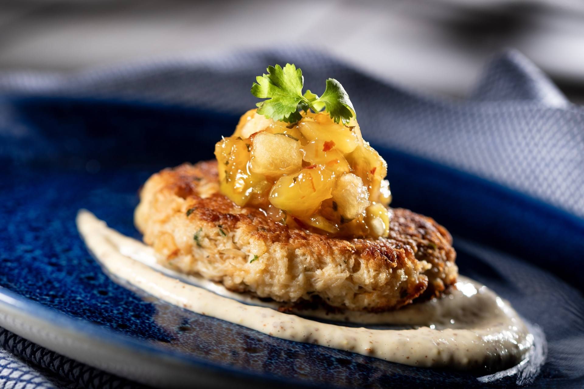 Crab Cake with Tropical Fruit Chutney Mustard Sauce and Micro Celery