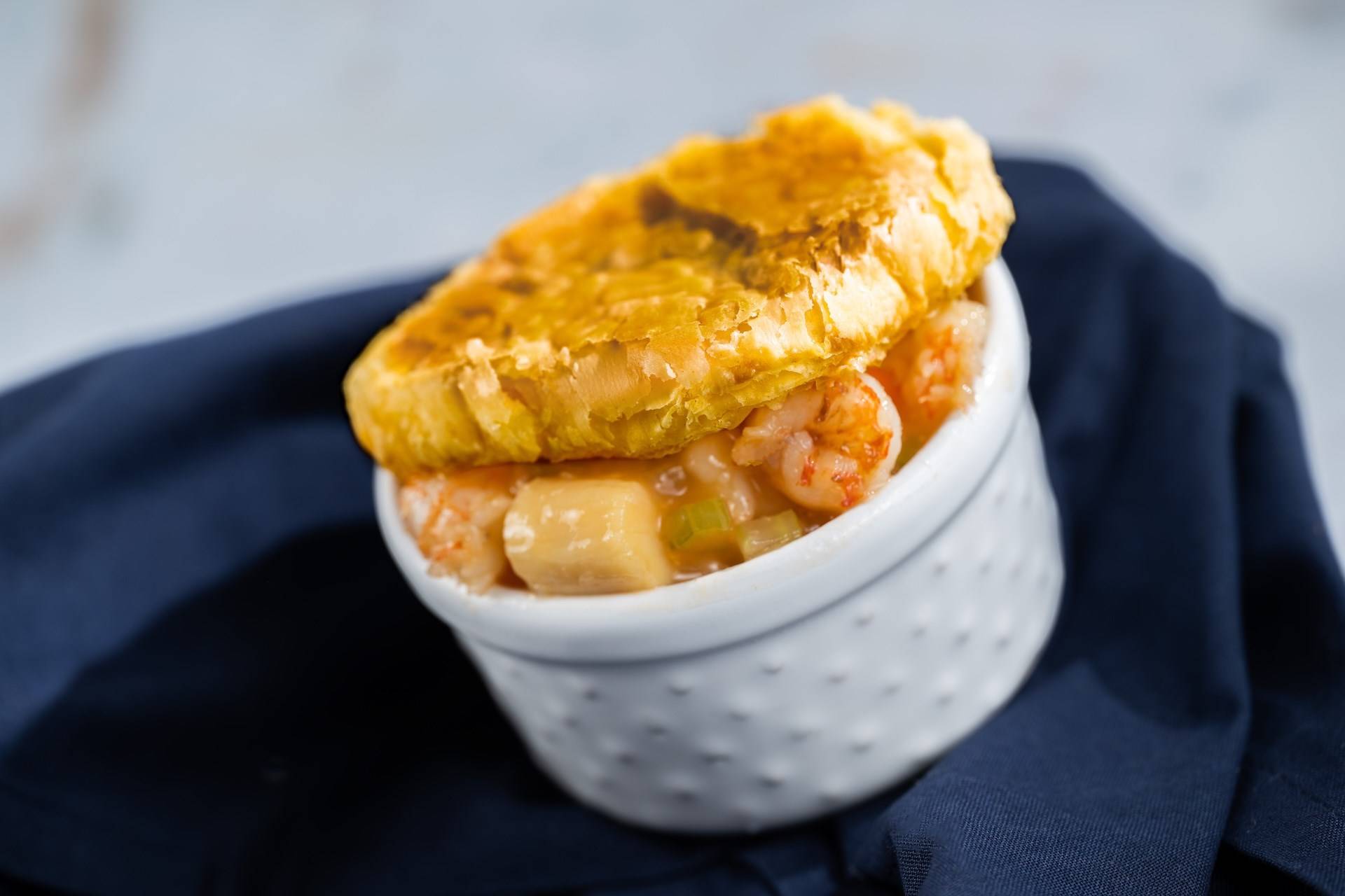 Seafood Pot Pie with Shrimp Scallops and Lobster Bisque Topped with Puff Pastry