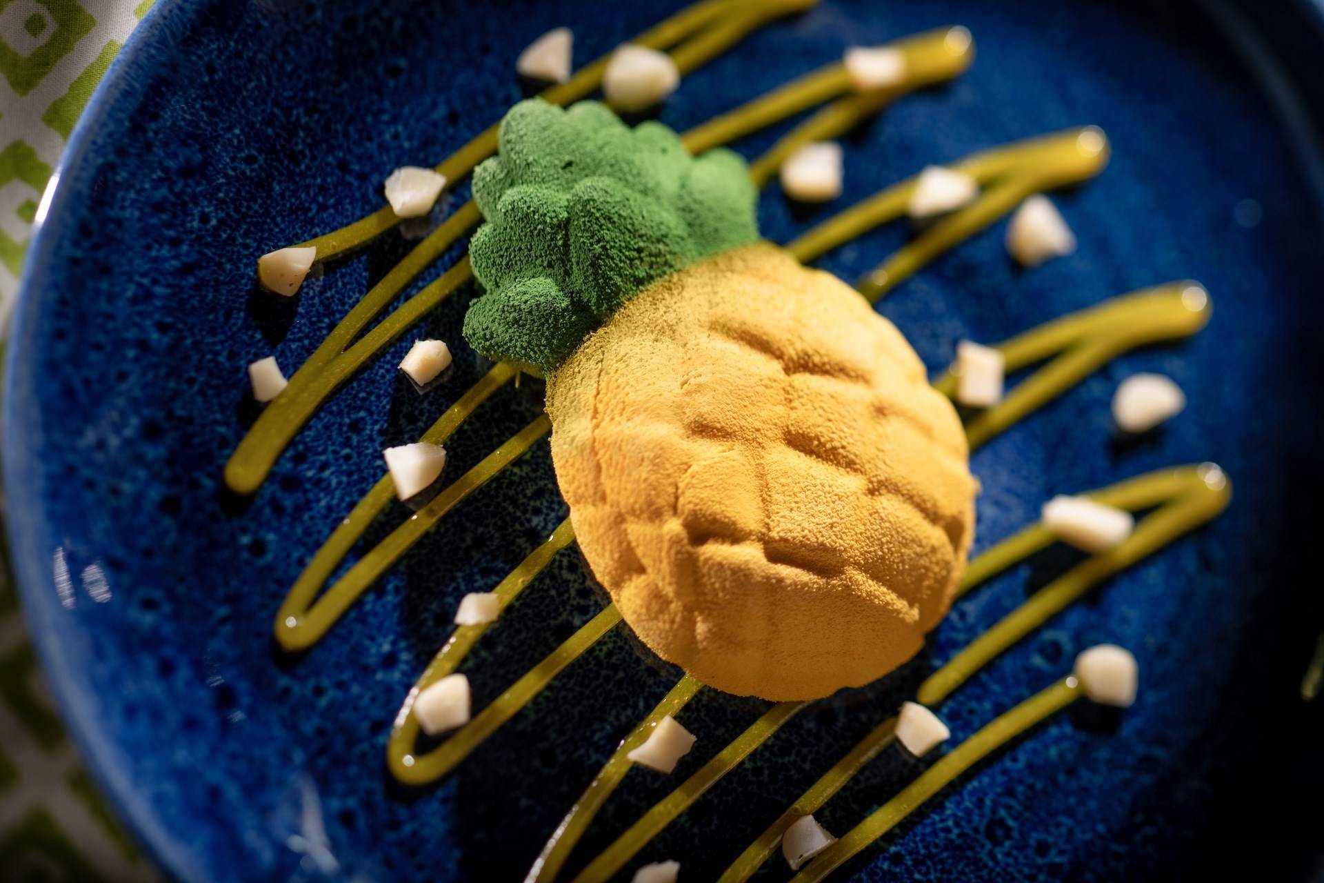 Pineapple Cheesecake with Passion Fruit Curd and Macadamia Nuts