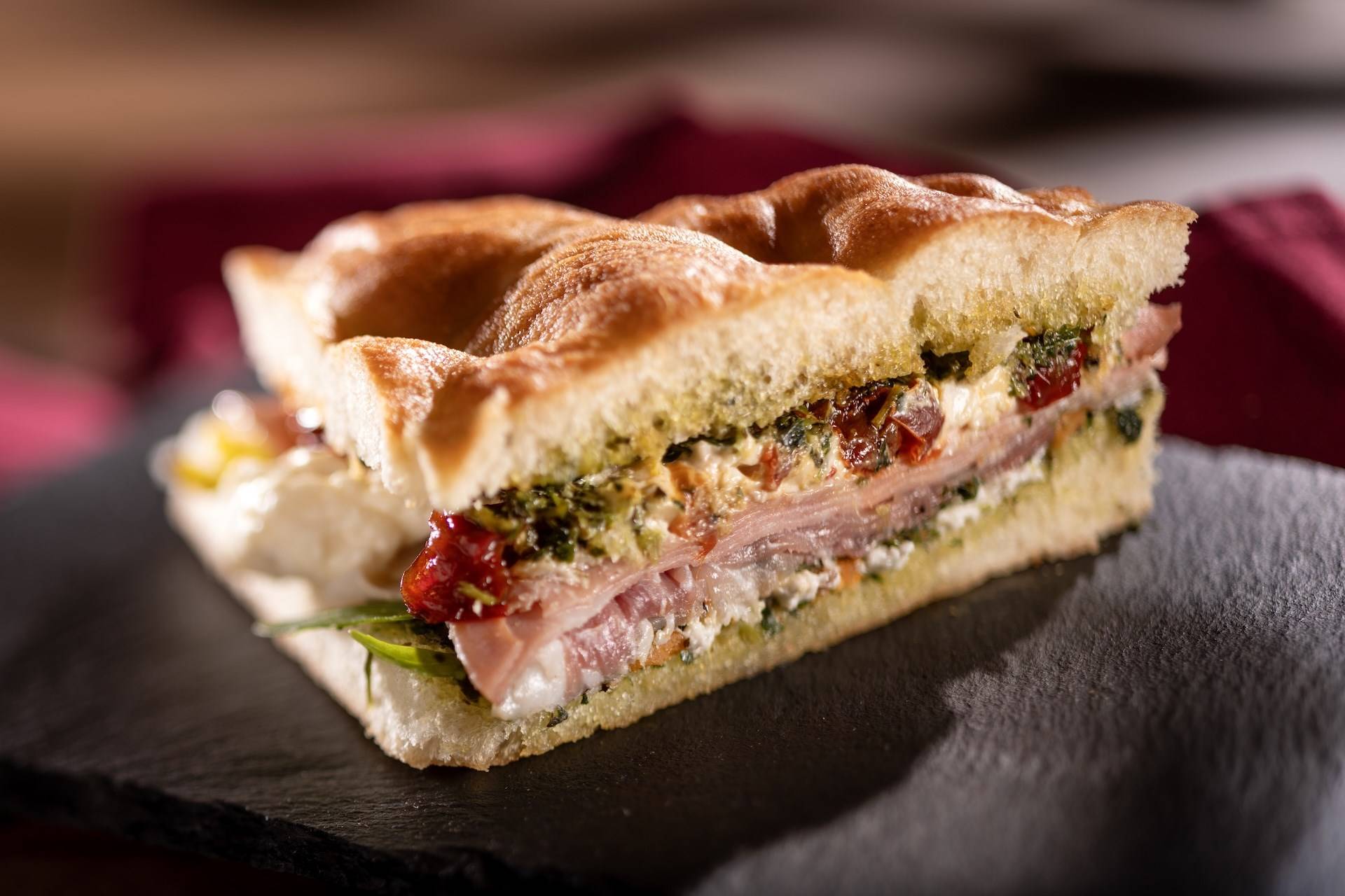 Schiacciata Sandwich Mortadella Prosciutto Ham Sun Dried Peppers Arugula Stracci