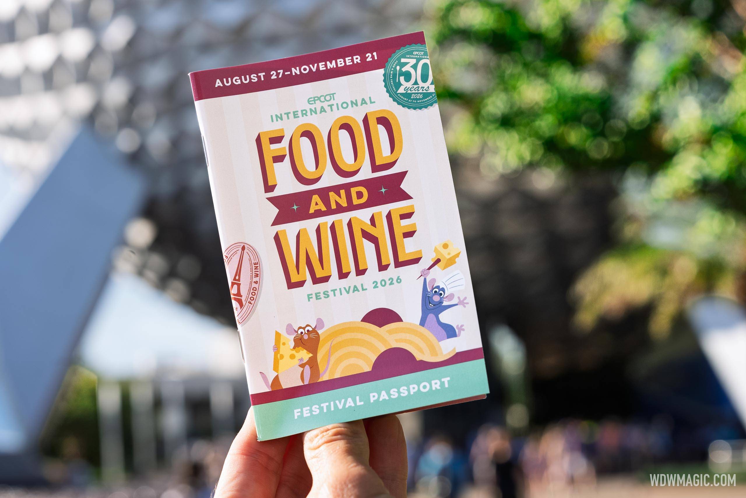 The 2026 Epcot International Food and Wine Festival Passport booklet features Remy and Emile from Ratatouille alongside the Aug 27 – Nov 21 run dates and 30th anniversary badge