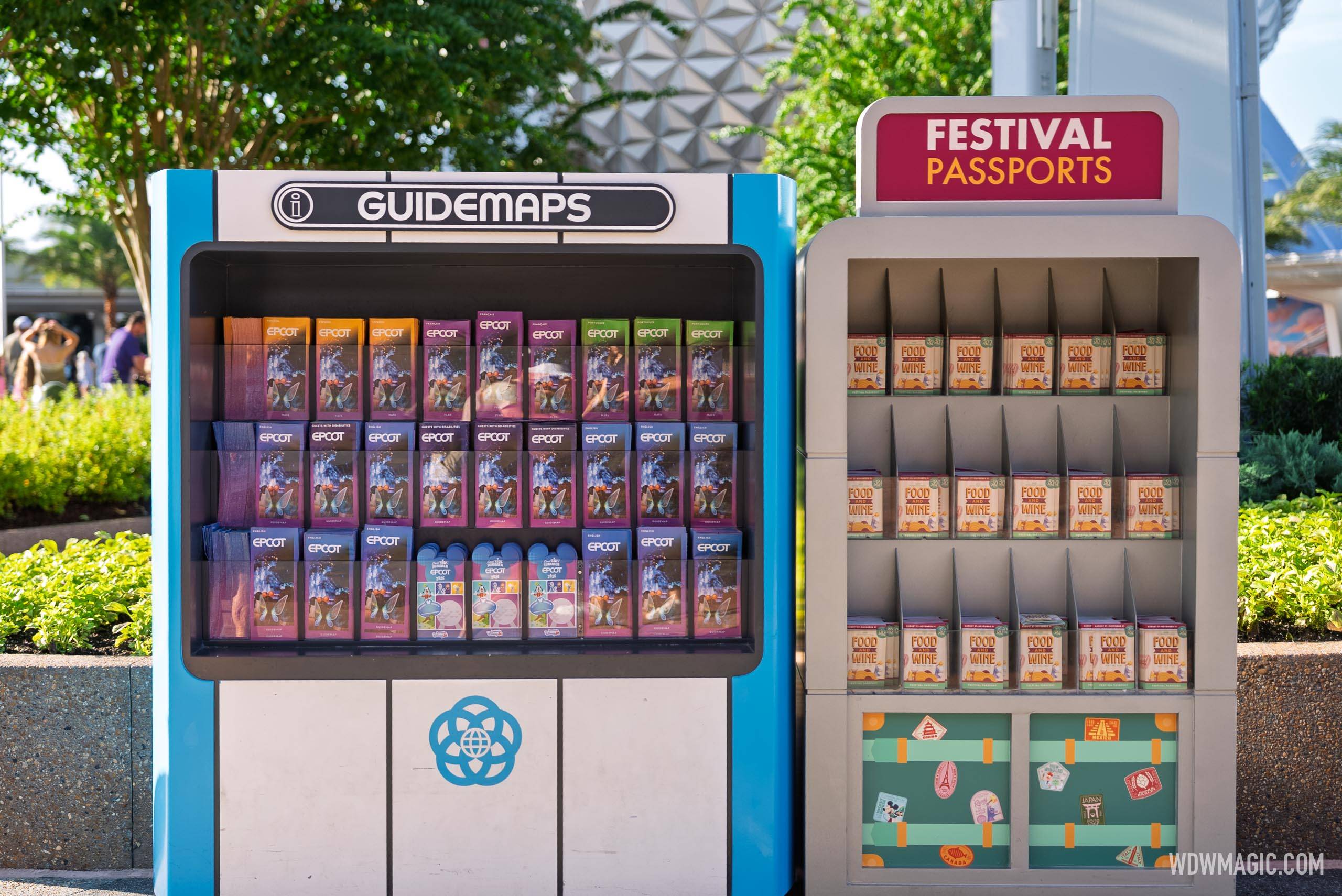 EPCOT Guidemaps and Food & Wine Festival Passports are available at display stands near the entrance plaza.