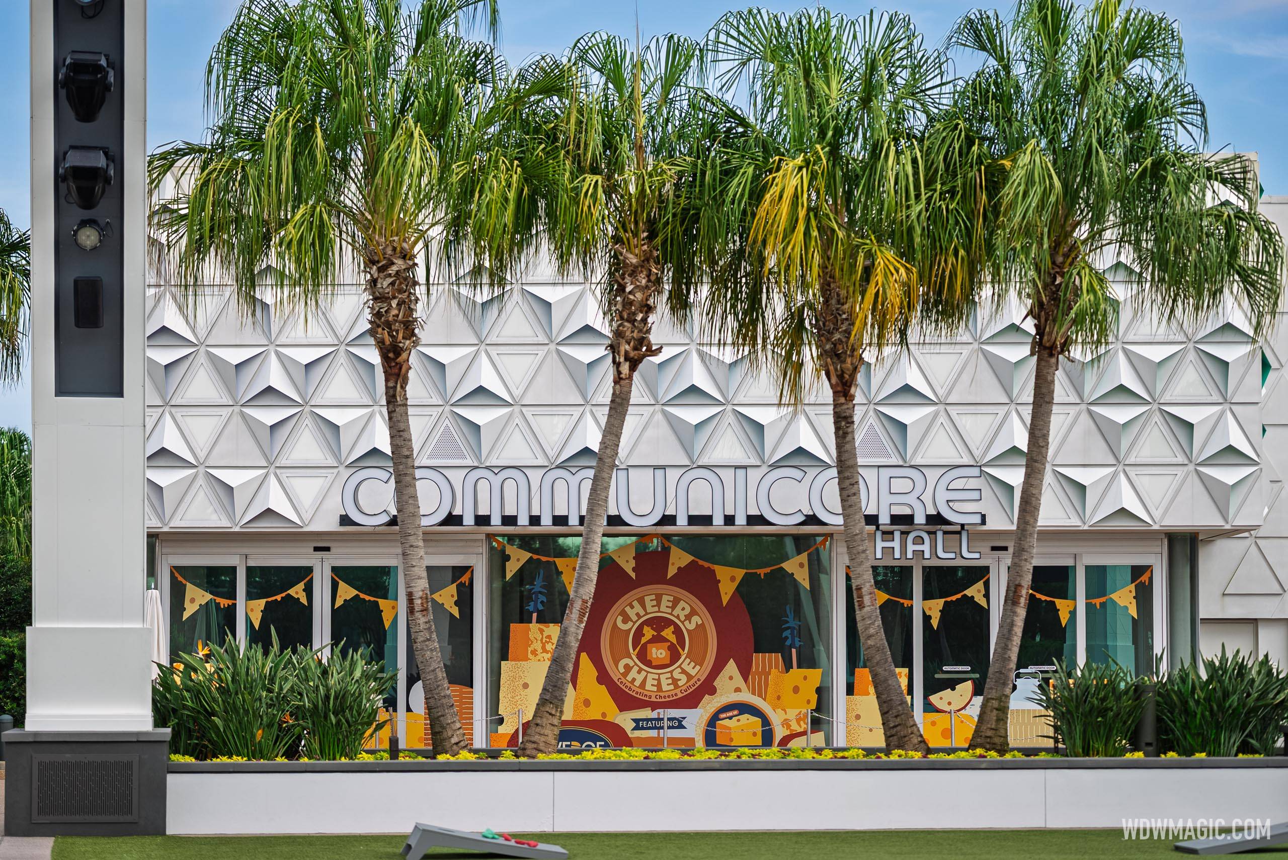 CommuniCore Hall's exterior features cheese-themed window graphics and "Cheers to Cheese"