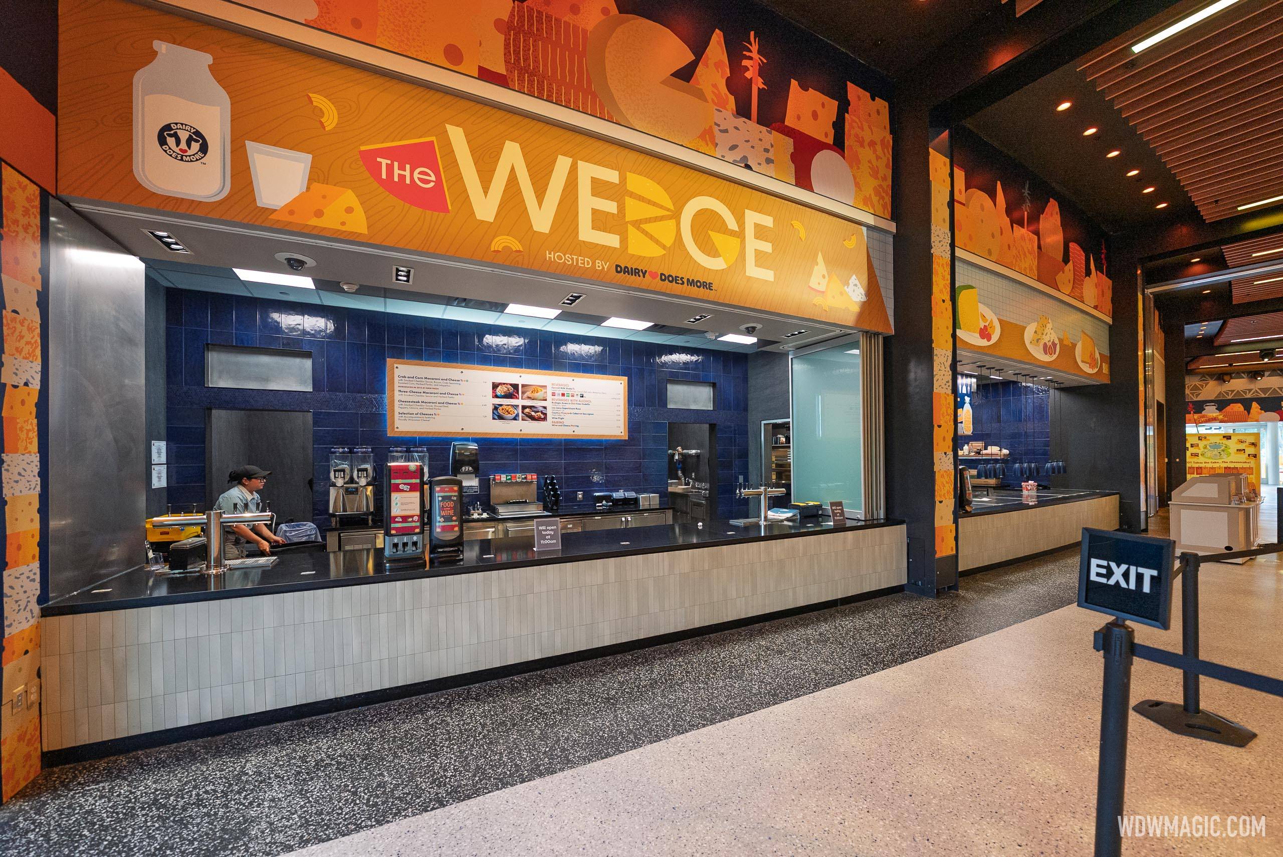 The Wedge marketplace booth, hosted by Dairy Does More, with its service counter, beverage dispensers, and menu board visible inside CommuniCore Hall