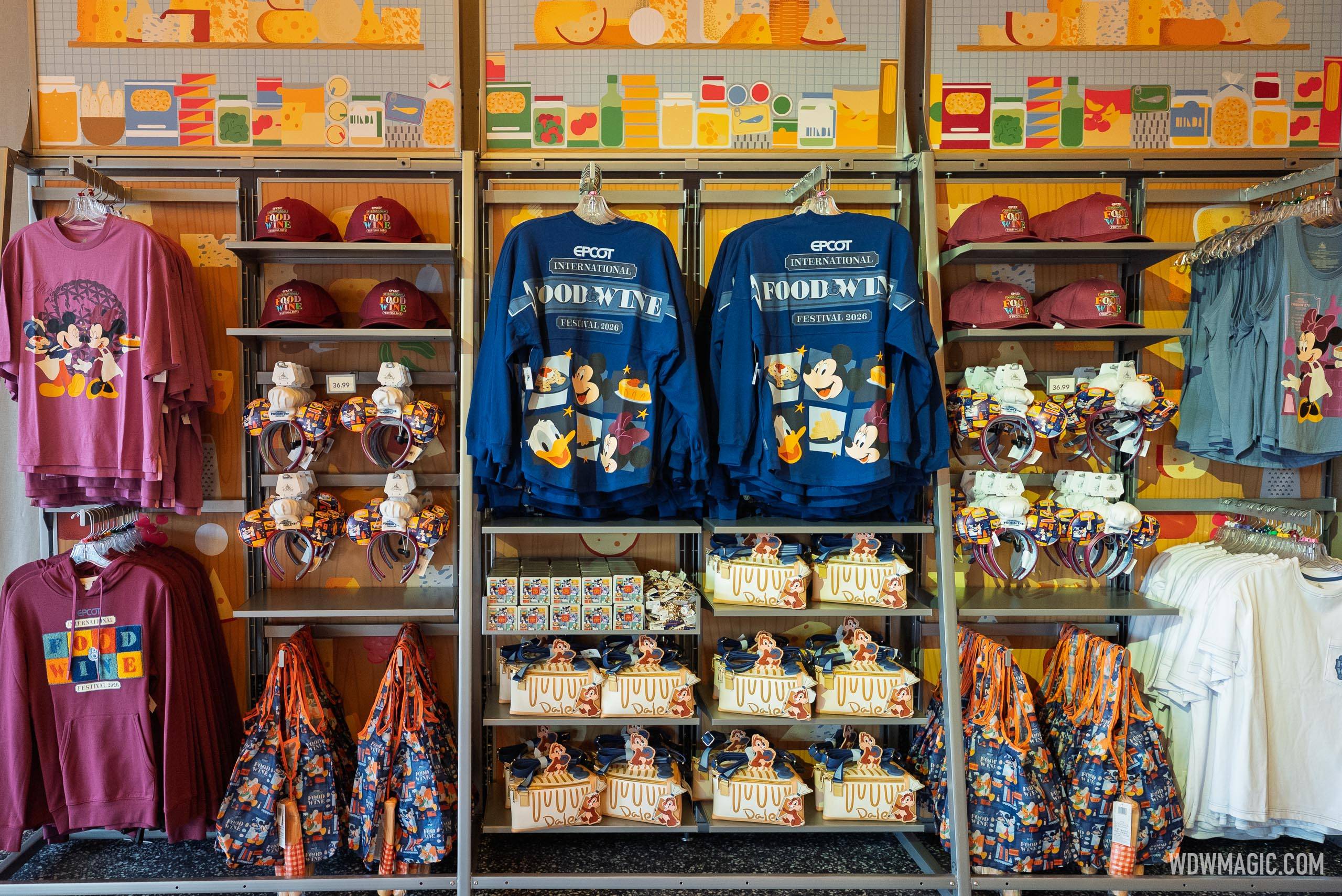 Epcot International Food and Wine Festival 2026 merchandise on display, including spirit jerseys, Mickey and Friends ear headbands, Loungefly bags, and apparel in the Food and Wine colorway