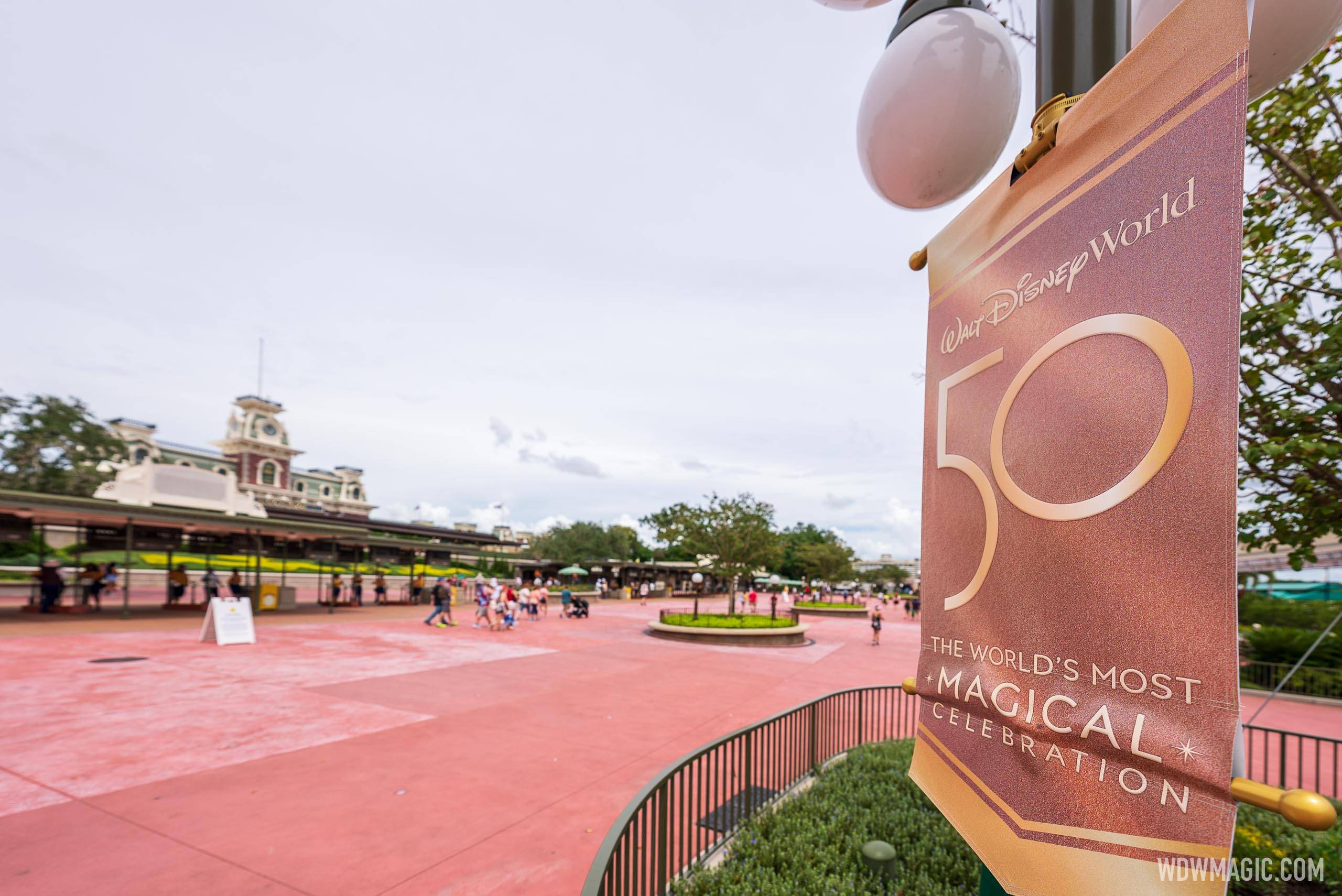 The World's Most Magical Celebration banners outside Magic Kingdom main entrance