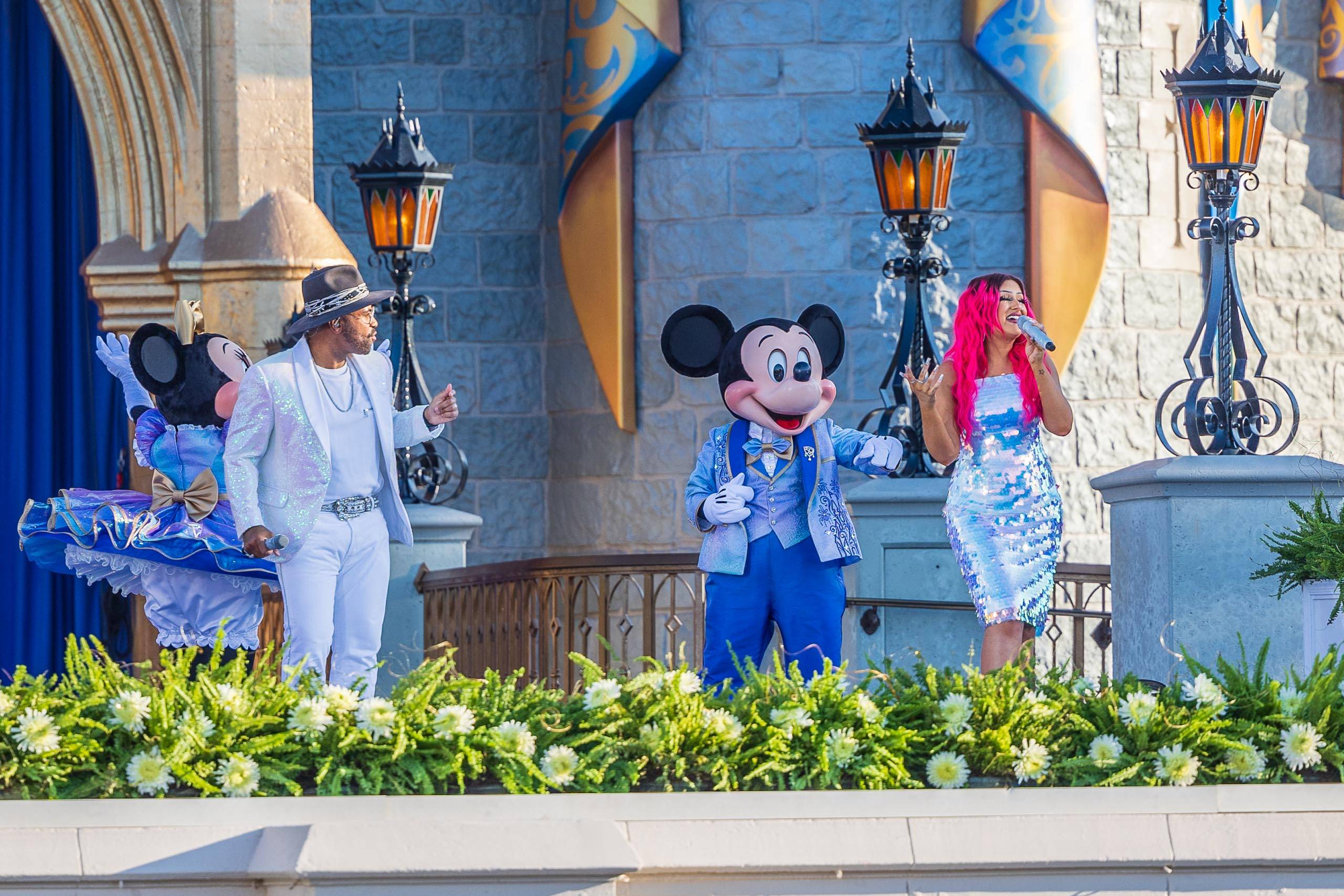 Philip Lawrence and Kayla Alvarez perform ''You are the Magic' at Cinderella Castle today as part of promotional shoot for Walt Disney World's 50th