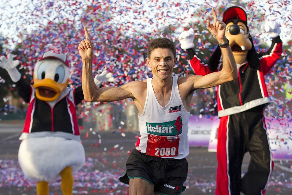  Fredison Costa, 33, from Brazil and now living in El Paso, Texas, celebrates Jan. 9, 2011 as he crosses the finish line to win the Walt Disney World Marathon in Lake Buena Vista, Fla. with an unofficial time of 2:21:14