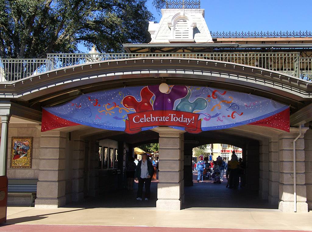 Celebrate Today banners appear at the Magic Kingdom entrance