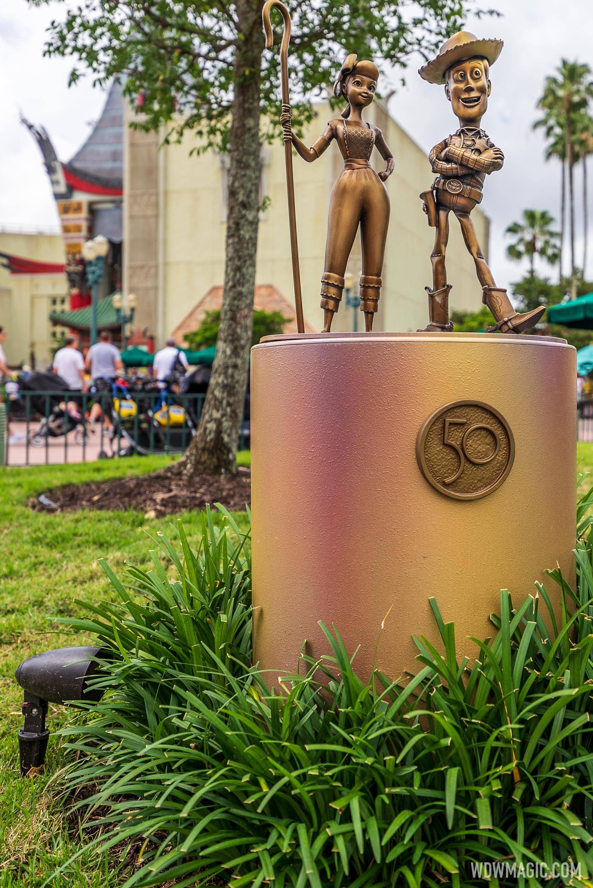 See how the MagicBand+ interacts with the Fab 50 golden character  sculptures at Walt Disney World