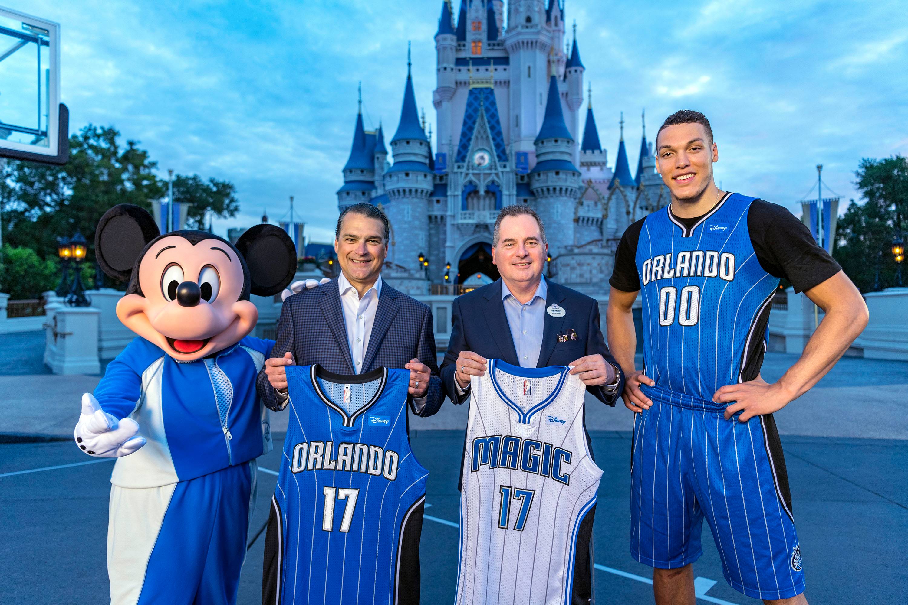 Orlando Magic CEO Alex Martins and Walt Disney World Resort President George A. Kalogridis pose with Orlando Magic star Aaron Gordon and Mickey Mouse as part of the announcement of Disney becoming the team’s first jersey sponsor