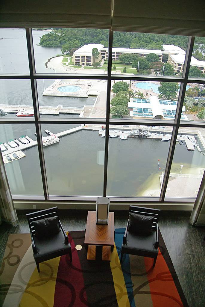 The view from the split level second story down into the living room and out onto Bay Lake and the Contemporary marina
