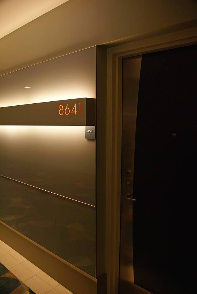 Red backlit room numbers give a very contemporary feel along the corridors