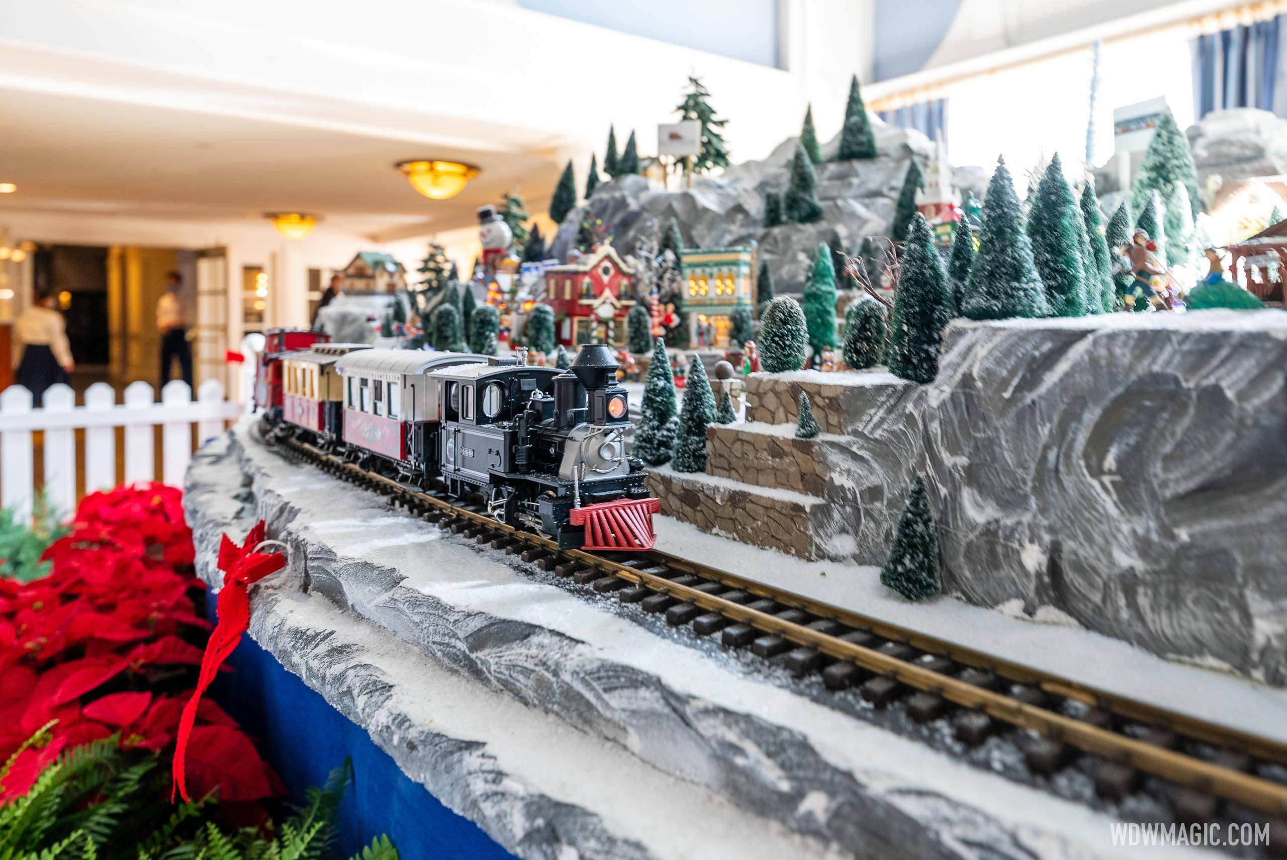 The model Christmas village includes a working train and ski lift