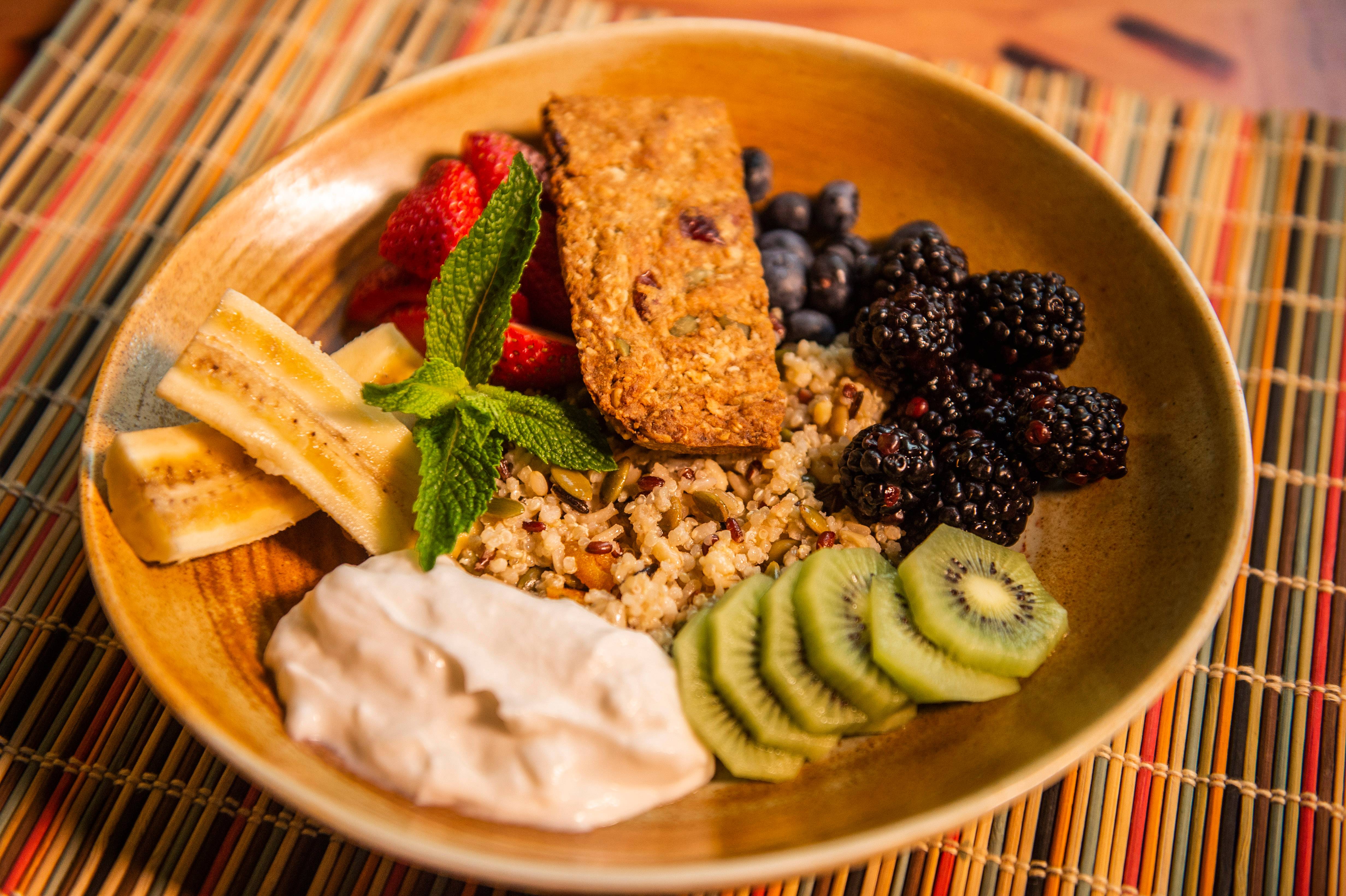 Plant Based Foods - Enriching Grains and Fruit from Sanaa at Animal Kingdom Lodge at Walt Disney World Resort, which features mixed grains, seasonal fruit, South African Rusk and coconut milk yogurt