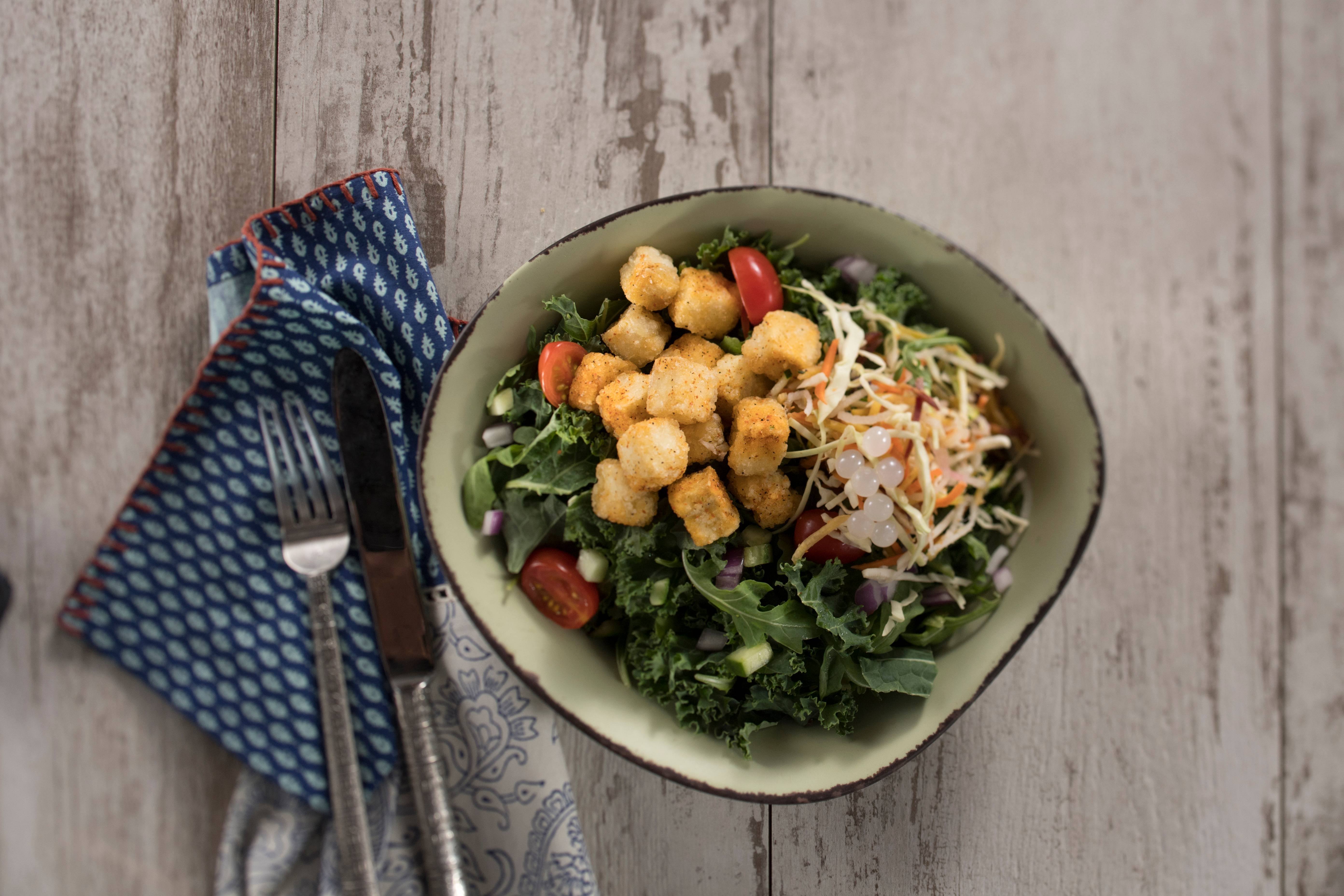 Plant Based Foods - Chili-Spiced Crispy Fried Tofu Bowl from Satu’li Canteen at Disney’s Animal Kingdom, which features crispy tofu, seasoned with chili-spice and topped with a crunchy vegetable slaw, boba balls and your choice of base and sauce