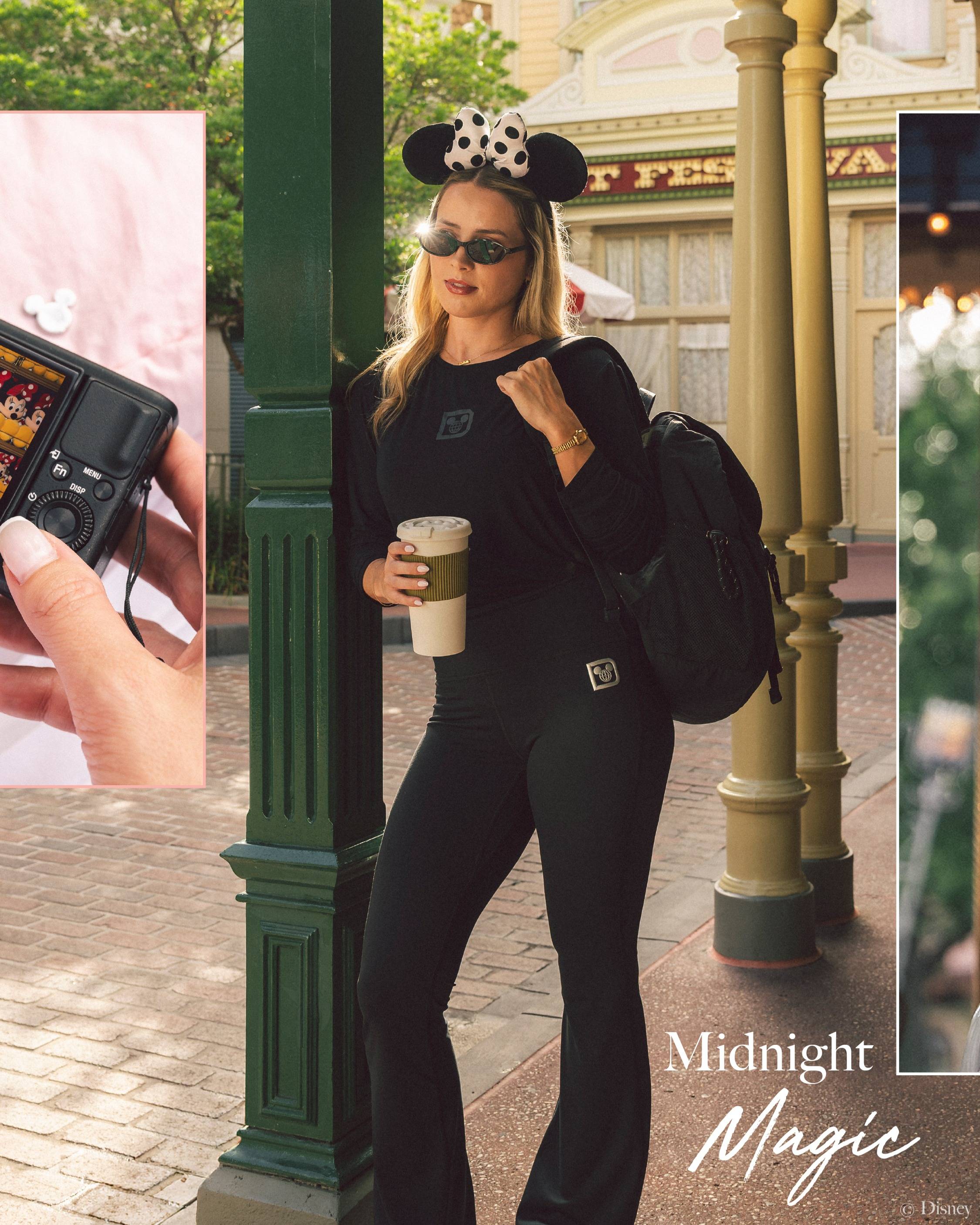 A model wears the Midnight Magic color story from the new Walt Disney World athleisure collection, including a black long-sleeve top, flare pants, and backpack, paired with Minnie ears