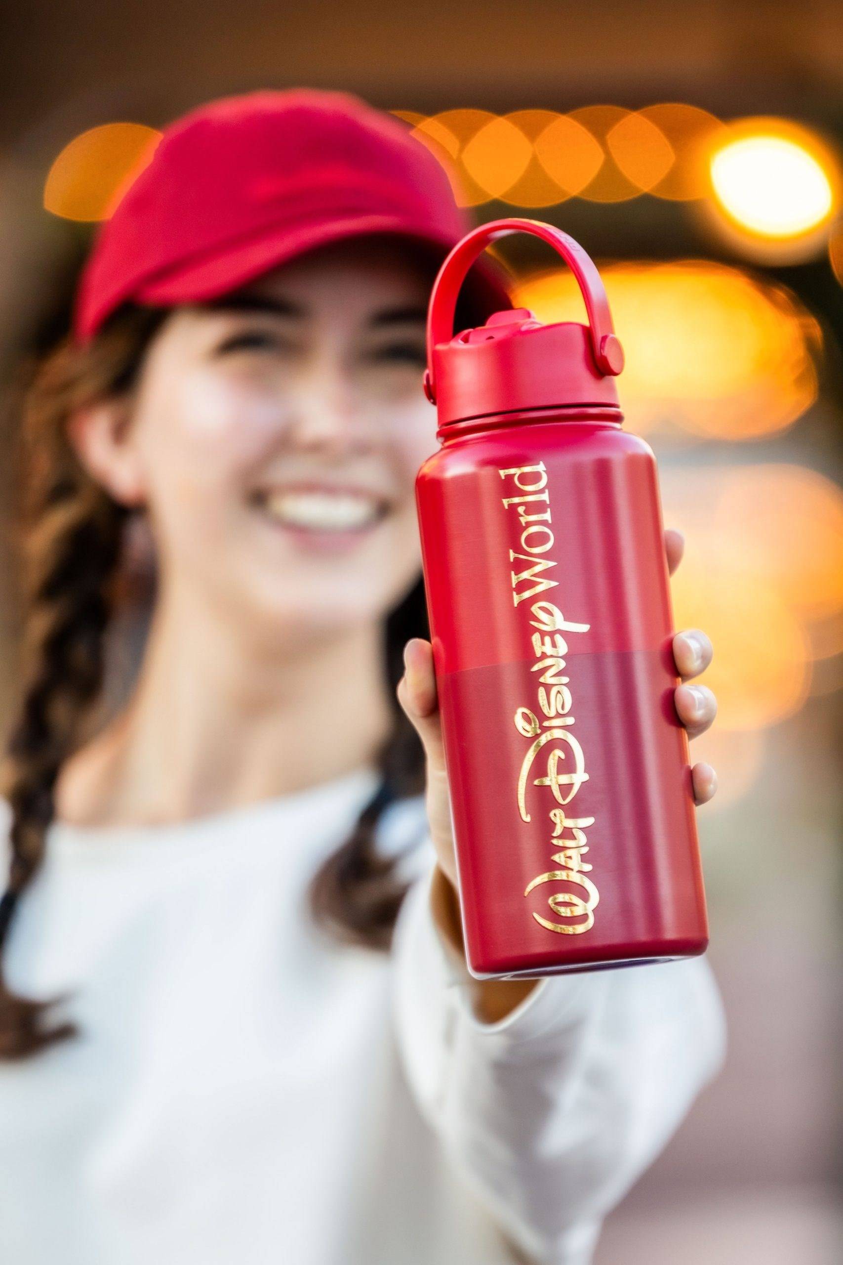 The red and gold Walt Disney World Logo Mania water bottle in the Main Street, U.S.A. colorway, available November 1 at the Emporium