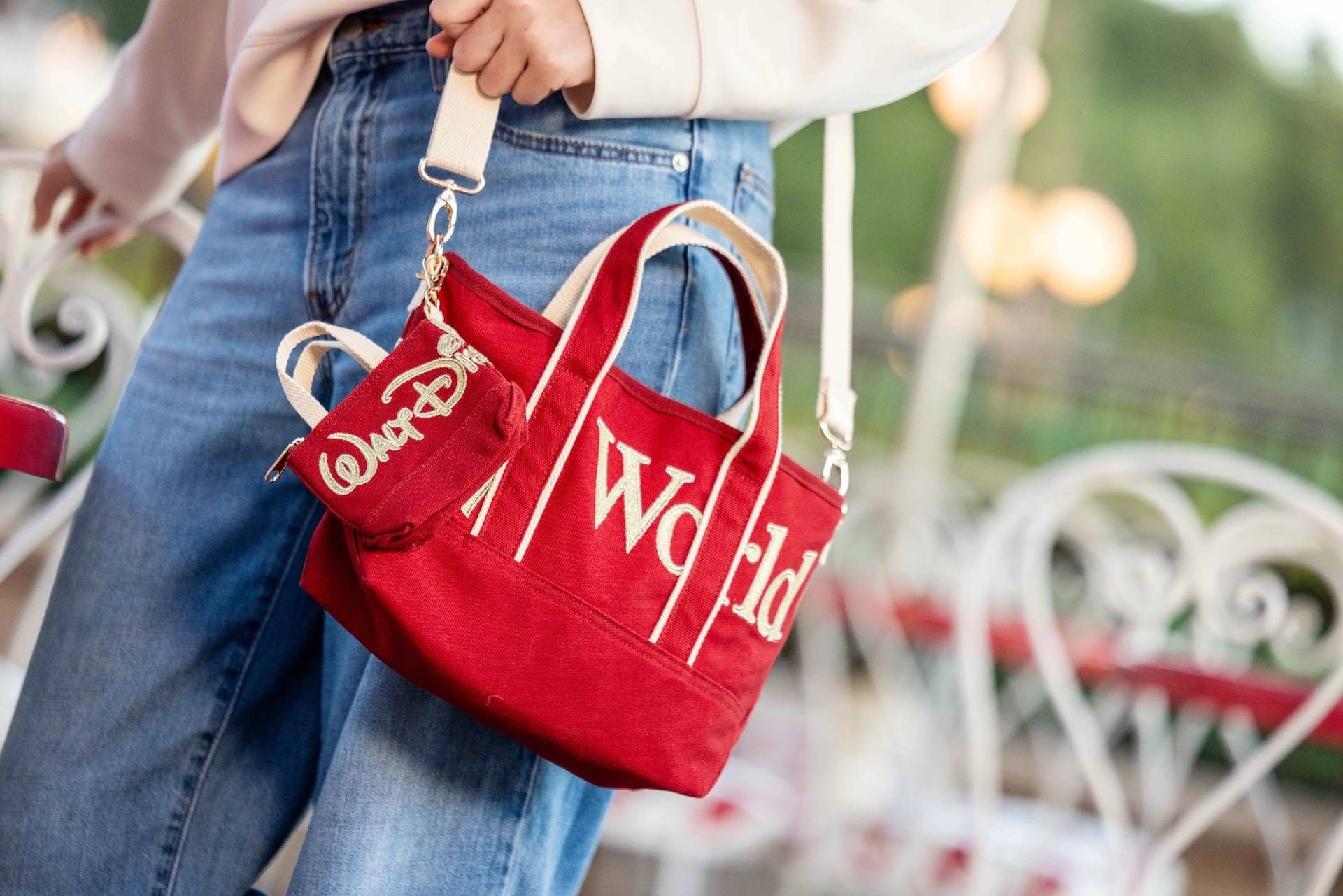 The red and gold Walt Disney World Logo Mania tote bag and coin purse in the Main Street, U.S.A. colorway, available November 1 at the Emporium