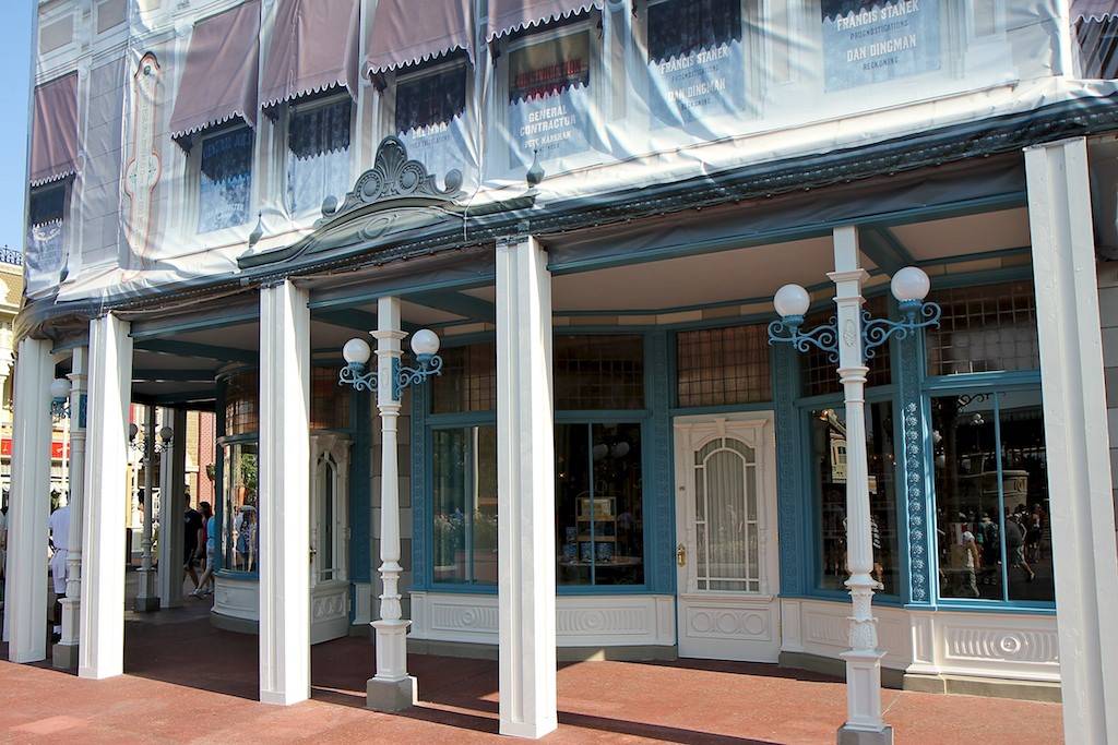 New color scheme revealed as some of the construction scrims come down on the Main Street Confectionary shop