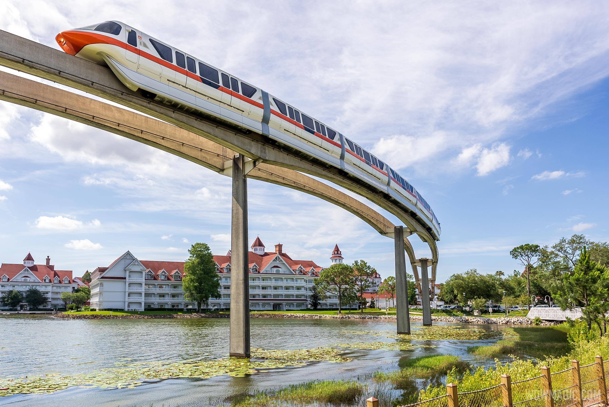 Monorail Orange on the Express Beam passes by Disney's Grand Floridian Resort