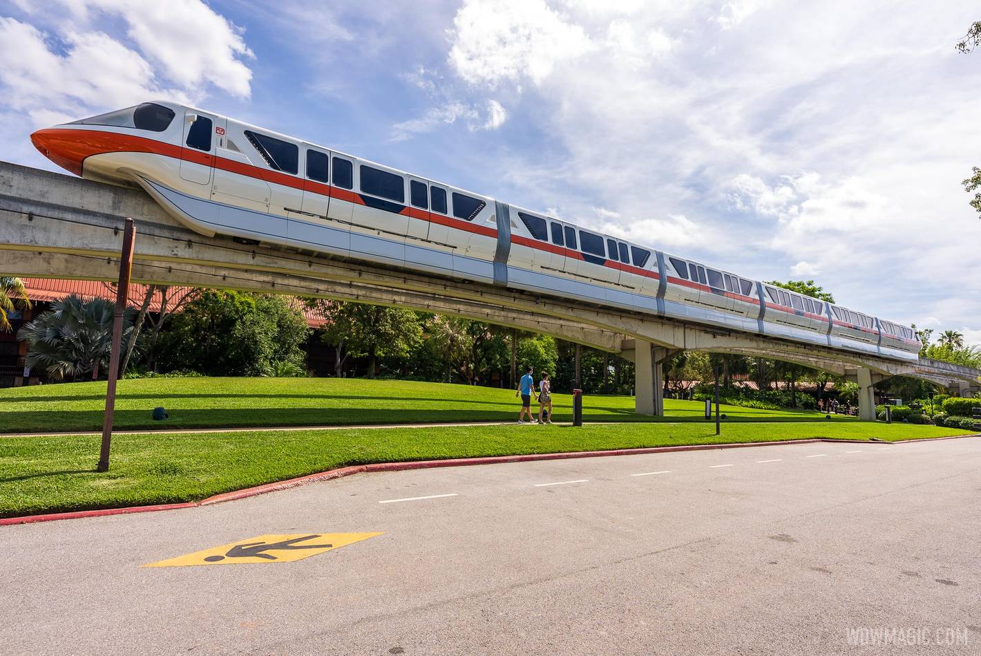 Monorail Orange on the Express Beam passes by Disney's Polynesian Village Resort