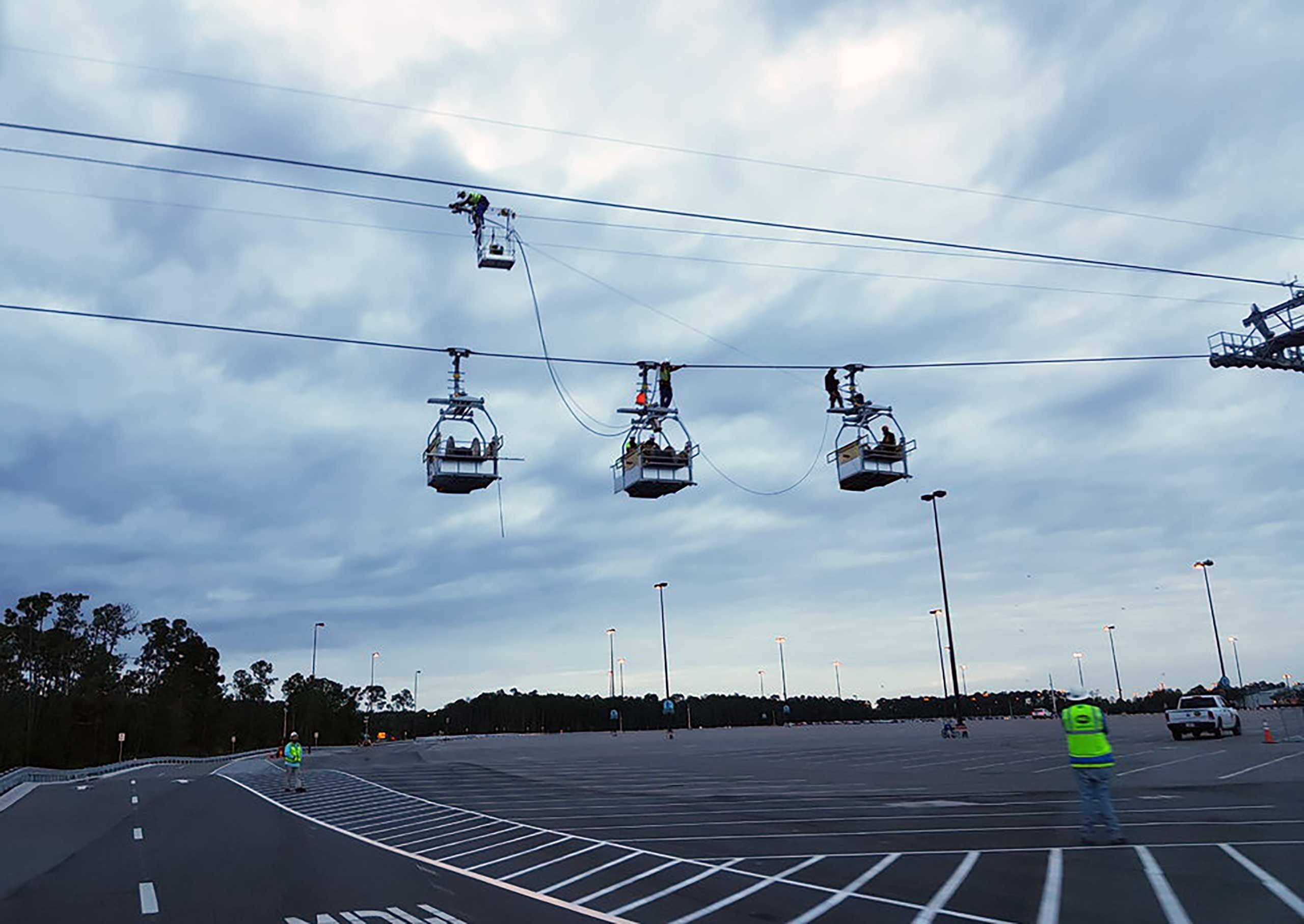 PHOTOS - Maintenance gondolas take to the Disney Skyliner cables