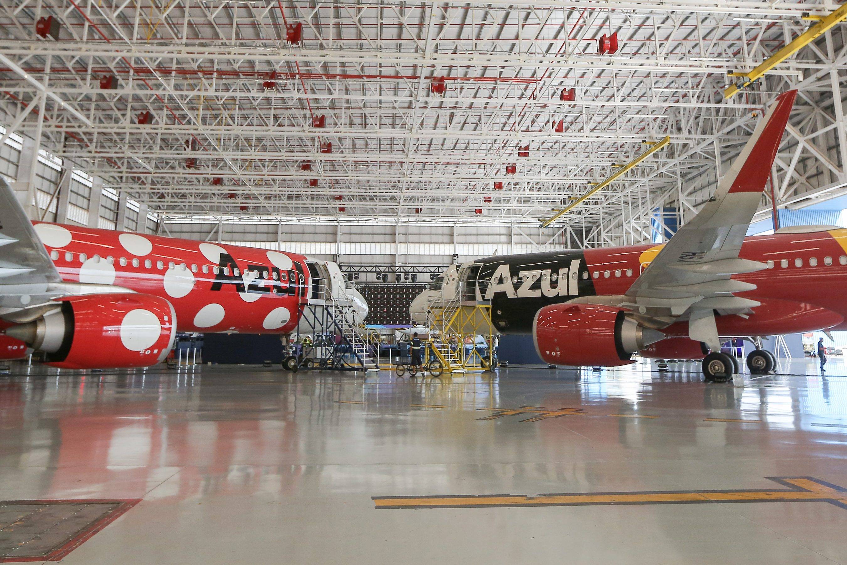 Mickey Mouse and Minnie Mouse-inspired airplanes meet for the first time during an announcement of a fifth Disney-character plane coming to the Azul fleet